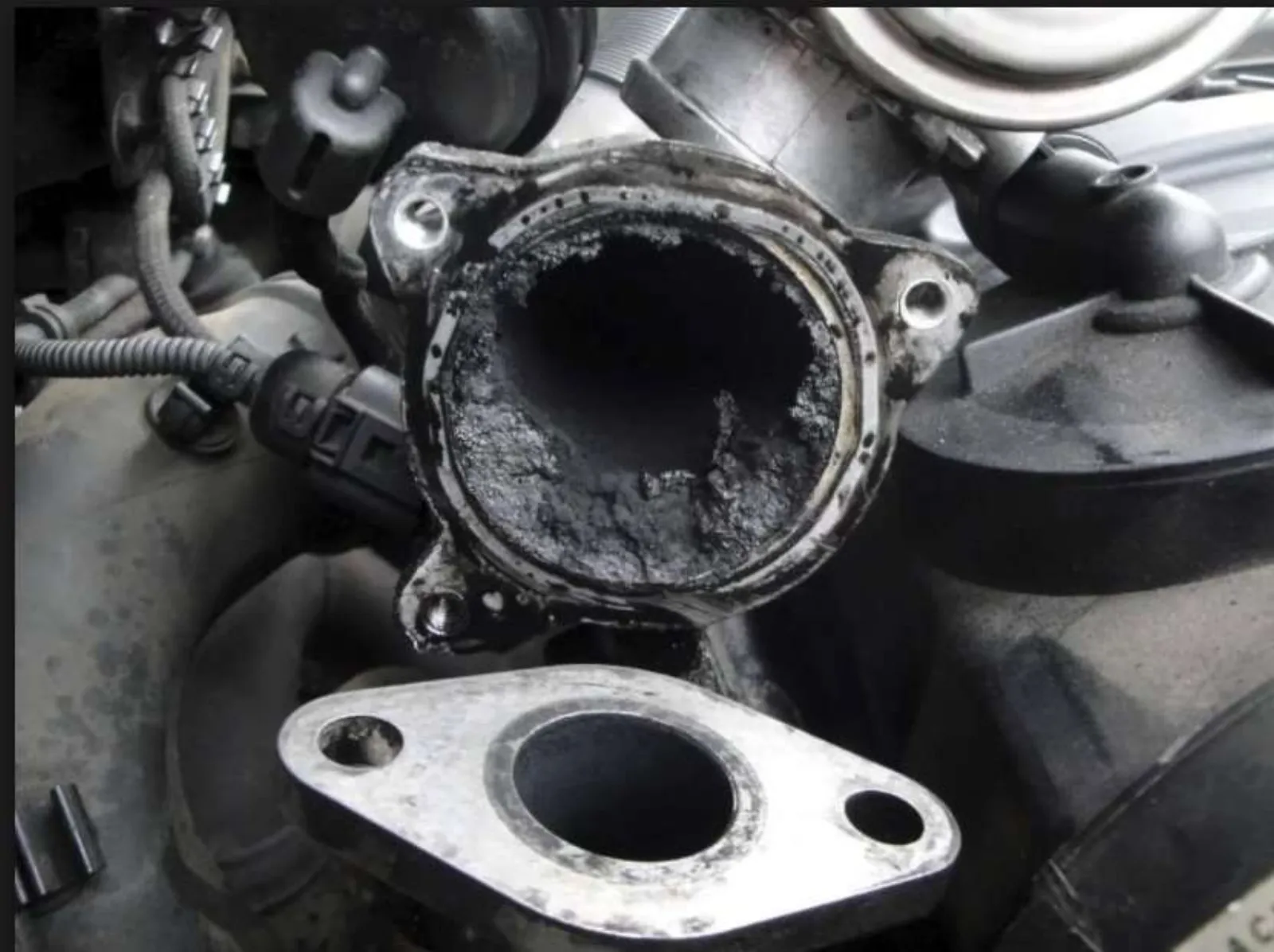 EGR valve heavily clogged with black carbon deposits